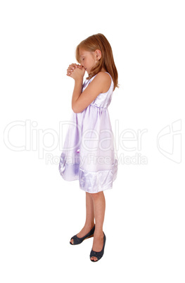 Young girl praying.