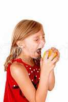 Girl like to eat an apple.
