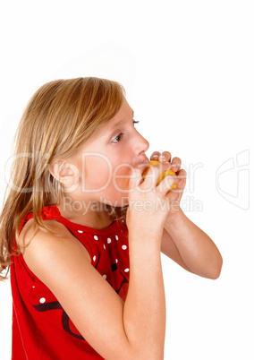 Girl eating an apple.