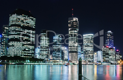 Stunning Brisbane skyline at night. City lights with river refle