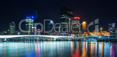 Stunning Brisbane skyline at night. City lights with river refle