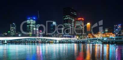Stunning Brisbane skyline at night. City lights with river refle