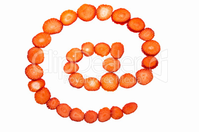 At symbol made from strawberry slices