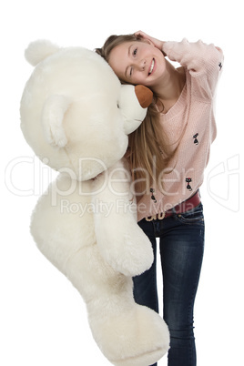 Photo of happy teenage girl with teddy bear