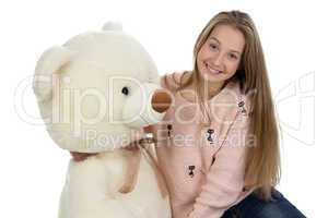 Photo of happy teenage girl with teddy bear