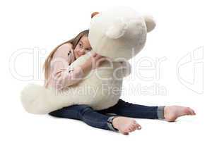 Image of girl hugging teddy bear