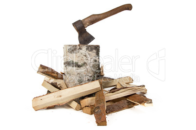 Image of axe in the birch stump and woods