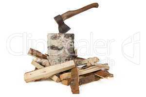 Image of axe in the birch stump and woods