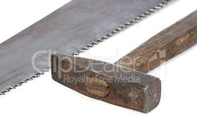 Photo of handsaw's teeth and hammer
