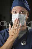 Shocked Female Doctor with Hand in Front of Mouth
