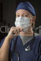 Female Doctor or Nurse Wearing Protective Face Mask