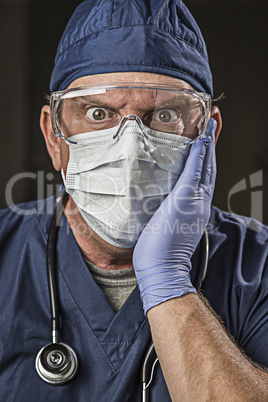 Stunned Doctor or Nurse with Protective Wear and Stethoscope