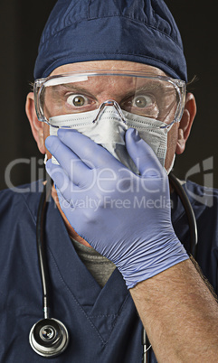 Stunned Doctor or Nurse with Protective Wear and Stethoscope