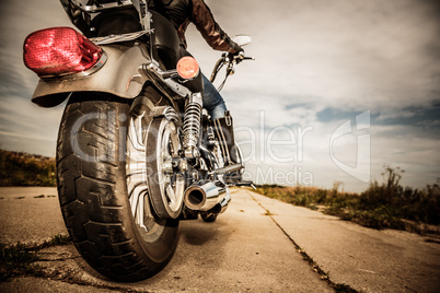 Biker girl riding on a motorcycle