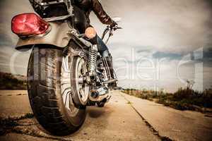 Biker girl riding on a motorcycle