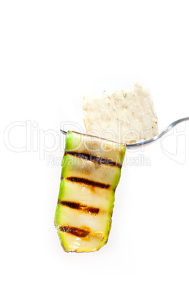 grilled zucchini courgette with cracker on a fork
