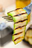 grilled zucchini courgette on a fork