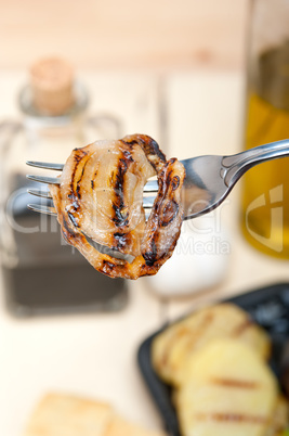 grilled onion on a fork