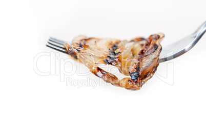 grilled onion on a fork