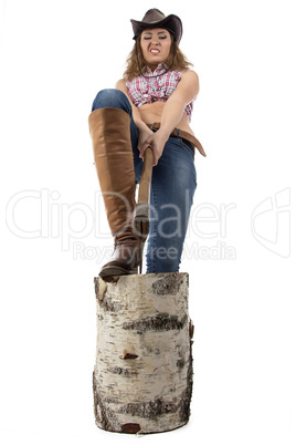 Image of young woman chops wood
