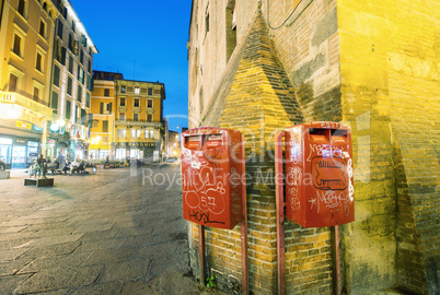 BOLOGNA, ITALY - OCTOBER 9, 2014: Red mail boxes outside a post