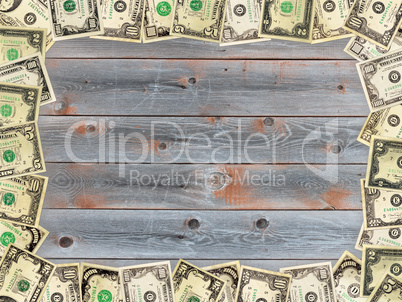 Frame from the dollars on the wooden board background