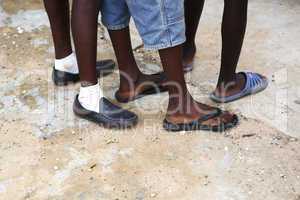Feet of African men in different shoes