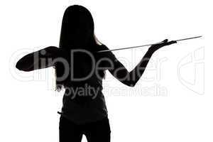 Silhouette of young woman looking at blade