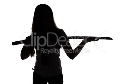 Silhouette of woman looking at blade