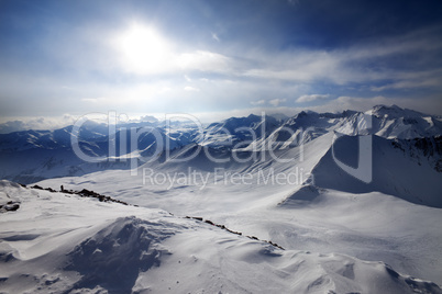 Snowy mountains and view on off-piste slope