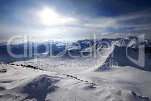 Snowy mountains and view on off-piste slope