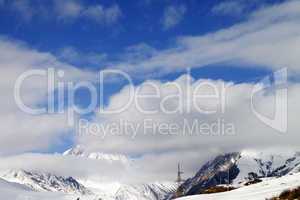 Ski slope and blue sky with clouds