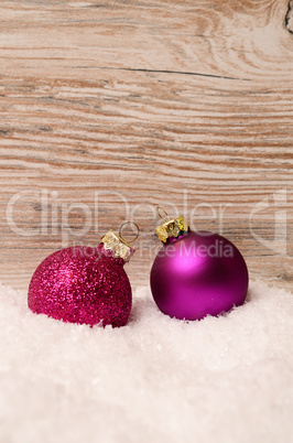 Christmas baubles on snow