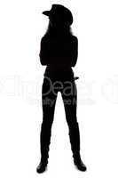 Silhouette of young cowgirl - full length