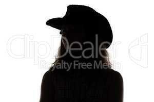 Silhouette of woman in cowboy hat