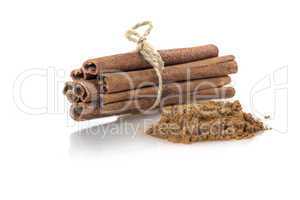 Cinnamon sticks and powder on White