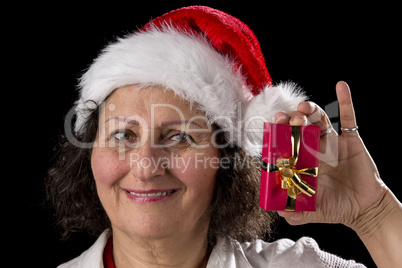 Venerable Woman with Red Cap Holding Small Gift.