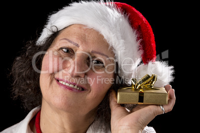 Middle-Aged Woman Holding Golden Gift