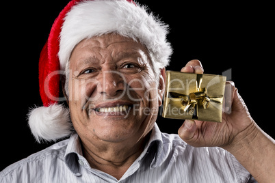Old Gentleman With Red Hat Offering Golden Gift