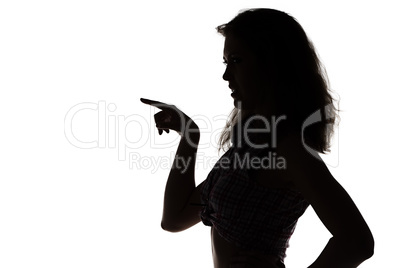 Silhouette of young woman with the forefinger