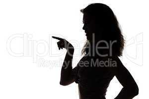 Silhouette of young woman with the forefinger
