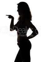 Silhouette of smiling woman with the forefinger