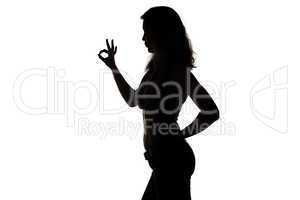 Silhouette of woman showing ok