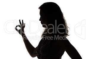 Silhouette of girl showing ok