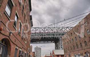 Metallic structure of Manhattan Bridge among classic Brooklyn bu