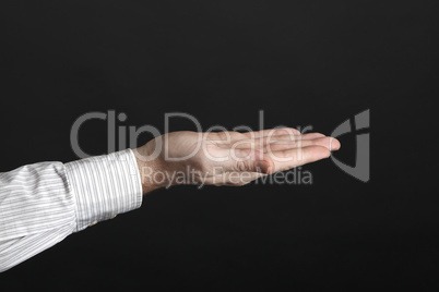 Caucasian male hands hold something