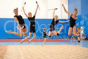 Girls with Indian clubs during high jump