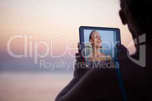 Woman making selfie on resort using pad