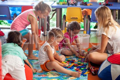 Children playing games in nursery