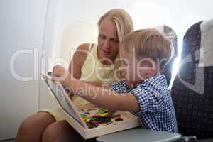 Mother and son playing together in the plane